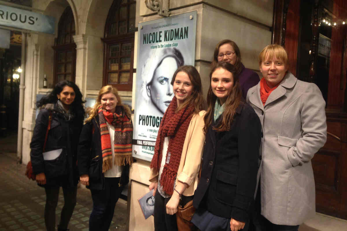 A photograph of students outside the theatre in London