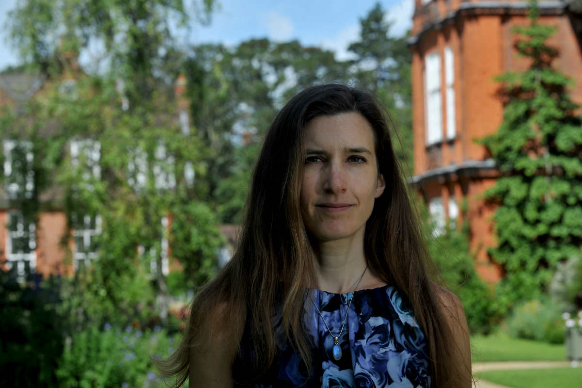 Dr Sophia Connell in the gardens at Newnham