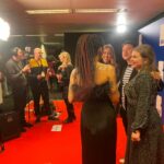 Zoe Howe and colleagues in front of film cameras
