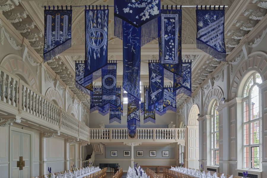 Banners hanging from the ceiling of a large hall
