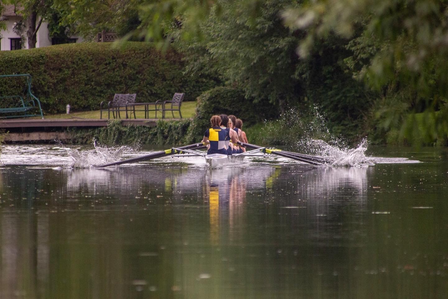 Boat rowing towards the viewer on a river